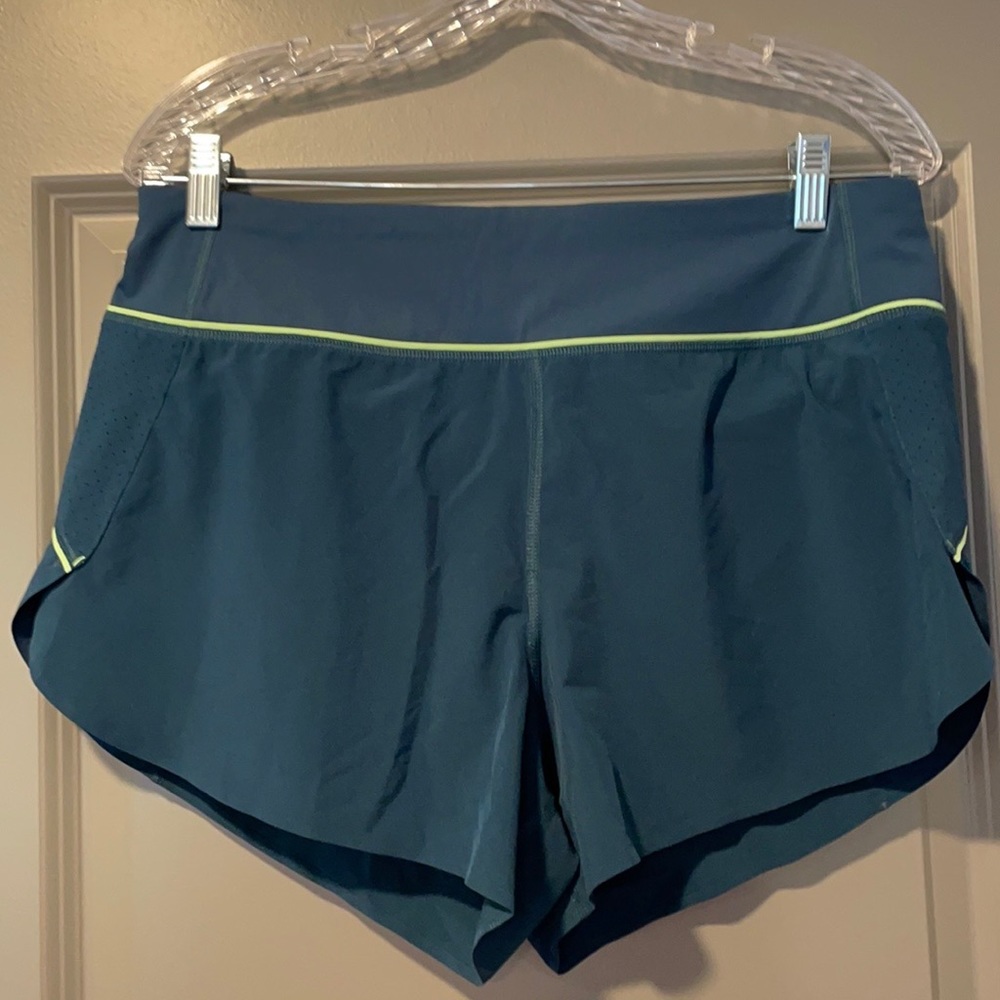 Athleta green/blue lined “run with it” athletic shorts size M